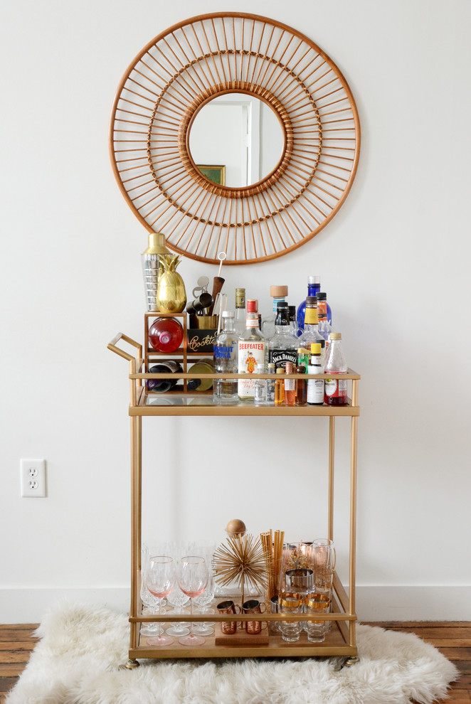Eclectic bar cart in Providence with medium hardwood floors and brown floor.