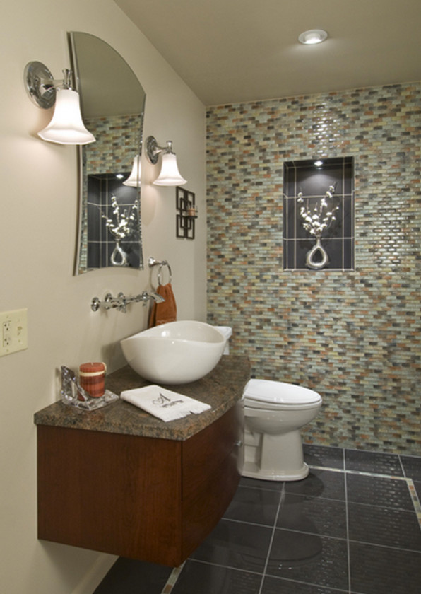 Mid-sized contemporary powder room in Philadelphia with flat-panel cabinets, dark wood cabinets, a two-piece toilet, beige tile, beige walls, ceramic floors, a vessel sink and grey floor.