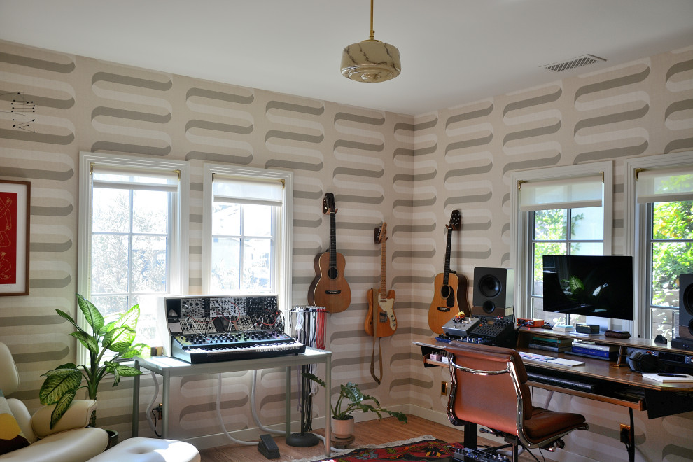 Example of a transitional home office design in Los Angeles