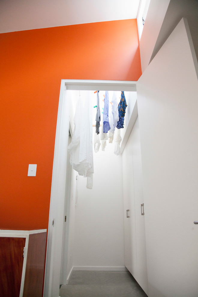 Photo of a small contemporary single-wall utility room in Sydney.
