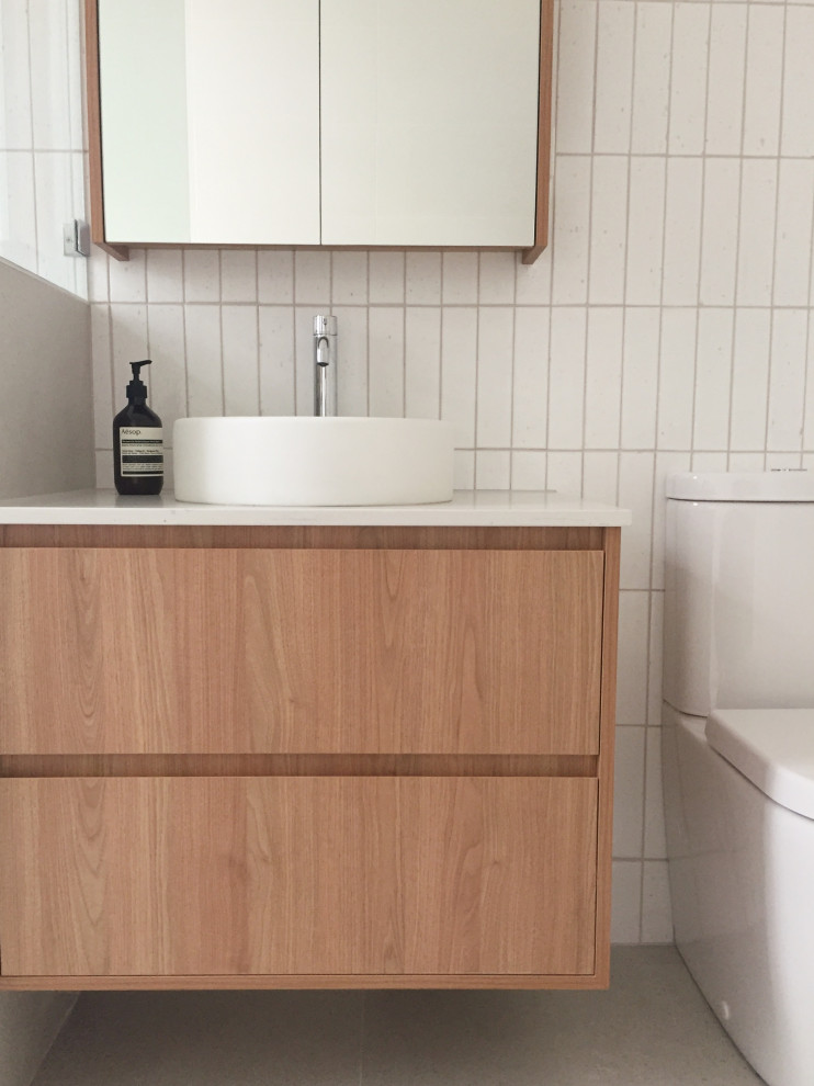 Inspiration for a small contemporary wet room bathroom in Perth with a built-in bath, white tiles, porcelain flooring, a vessel sink, engineered stone worktops, grey floors, an open shower, a single sink and a floating vanity unit.