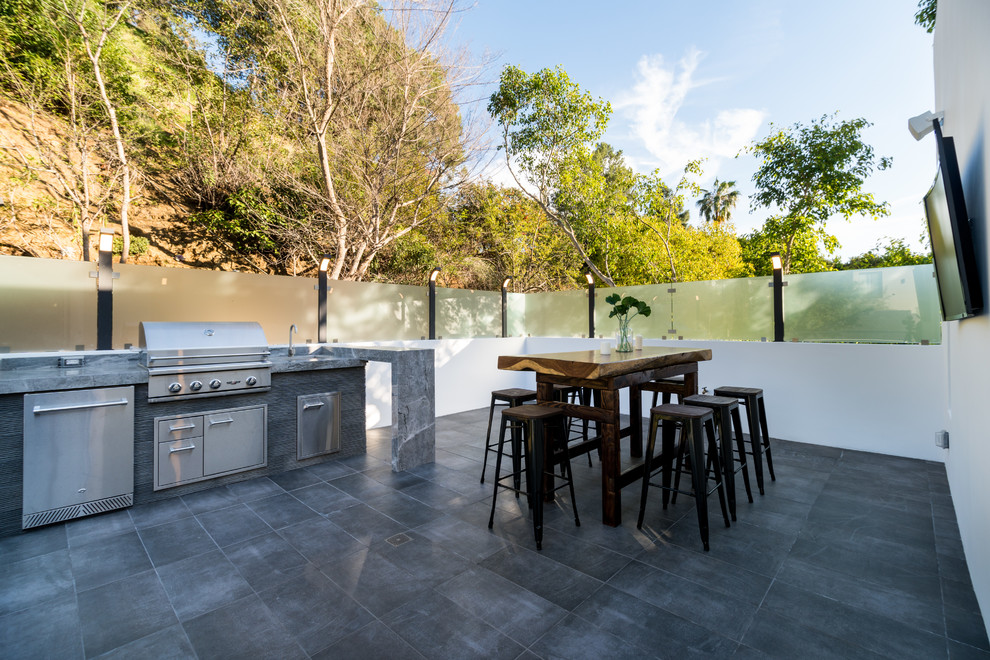 Design ideas for a contemporary rooftop and rooftop deck in Los Angeles with an outdoor kitchen and no cover.