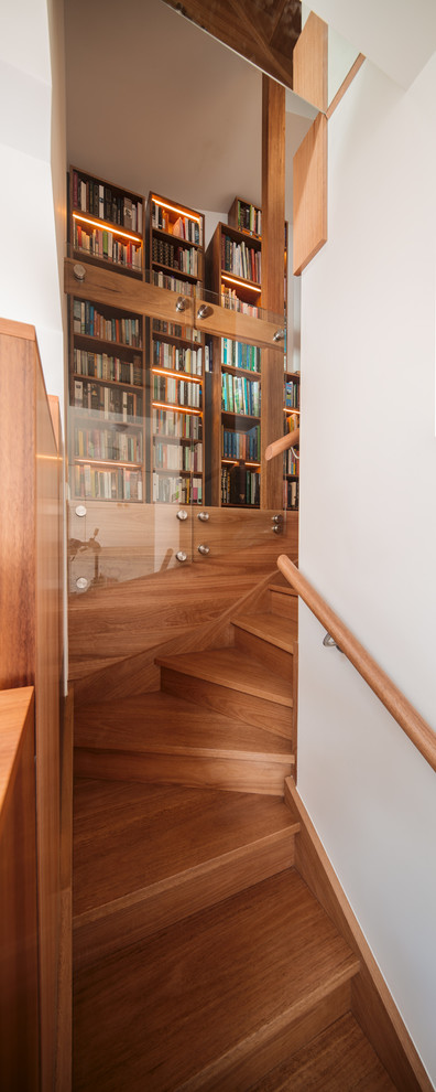 Small contemporary wood u-shaped staircase in Melbourne with wood risers.