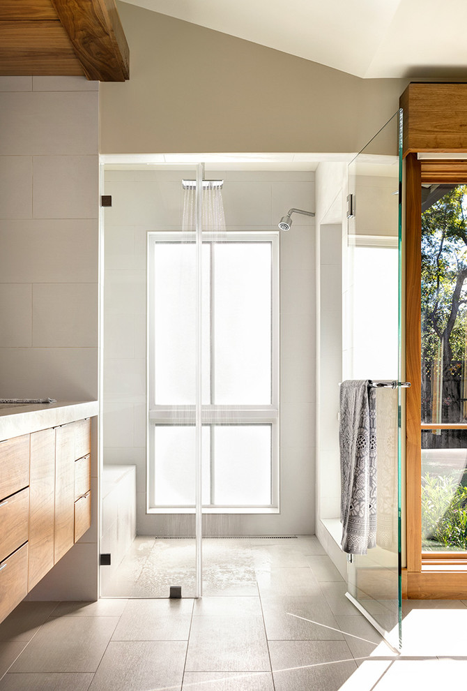 This is an example of a contemporary bathroom in San Francisco with a hinged shower door.