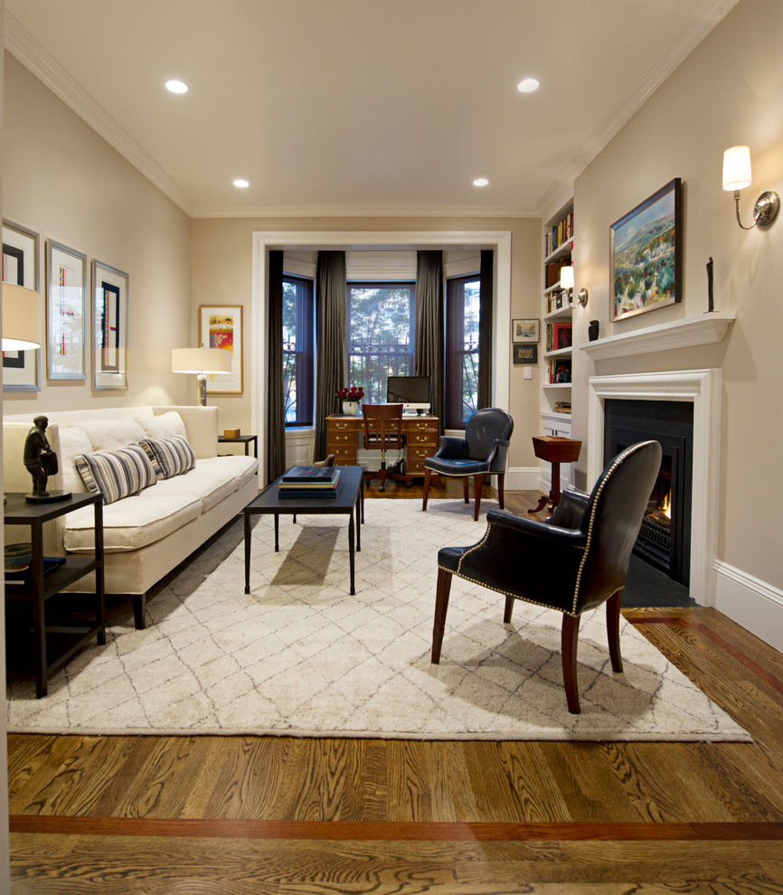 Photo of a mid-sized traditional formal open concept living room in Boston with beige walls, dark hardwood floors, a standard fireplace, no tv and a plaster fireplace surround.