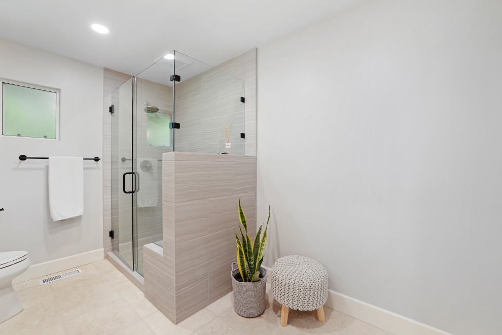 Example of a minimalist master gray tile and ceramic tile single-sink corner shower design in Sacramento with flat-panel cabinets, brown cabinets, an undermount sink, a hinged shower door, white countertops and a floating vanity