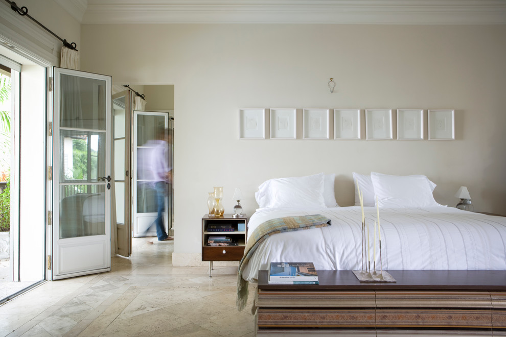 Contemporary bedroom in Miami with beige walls.