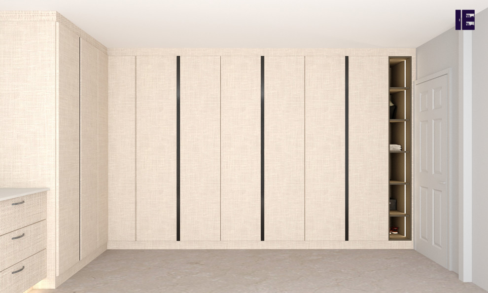 Photo of a large contemporary built-in wardrobe in London with flat-panel cabinets and beige cabinets.