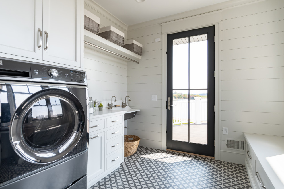 Design ideas for a country galley utility room in Grand Rapids with an utility sink, recessed-panel cabinets, white cabinets, quartz benchtops, white splashback, white walls, a side-by-side washer and dryer, multi-coloured floor, white benchtop and planked wall panelling.