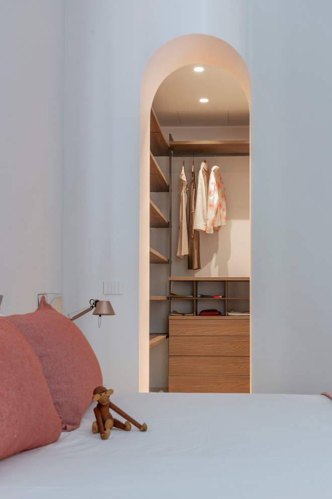 Photo of a contemporary storage and wardrobe in Milan.