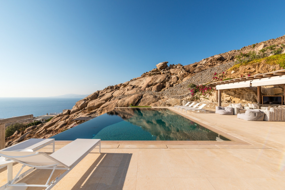 Inspiration for a mediterranean rectangular infinity pool in Other.