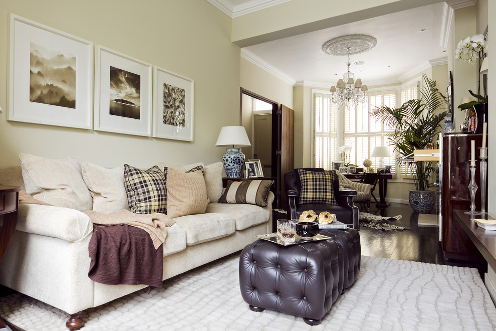 Inspiration for a traditional enclosed living room in London with beige walls.