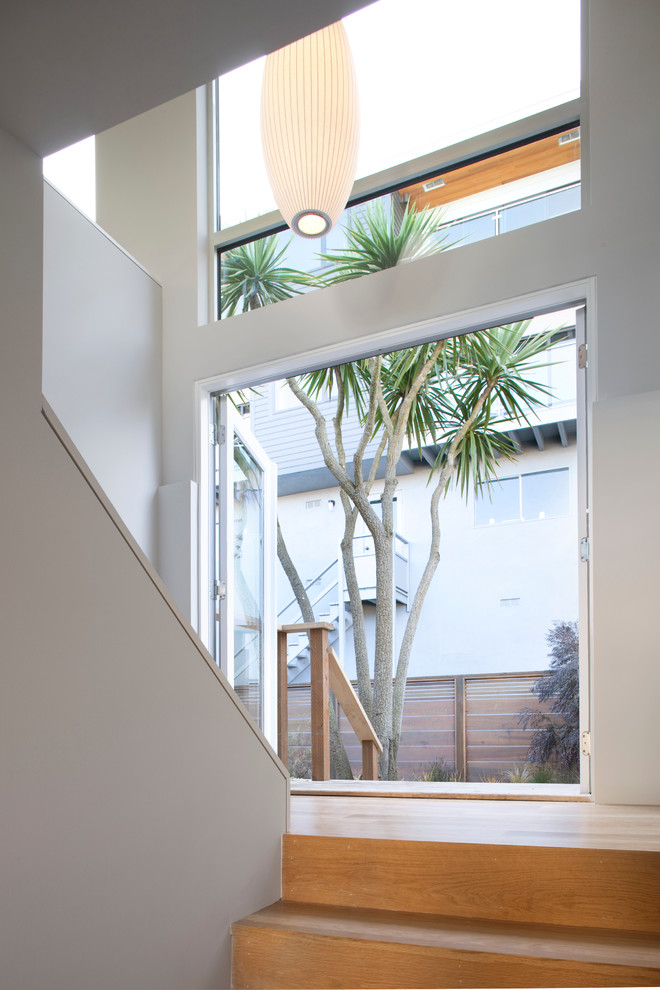 Inspiration for a modern wood staircase in San Francisco with wood risers.