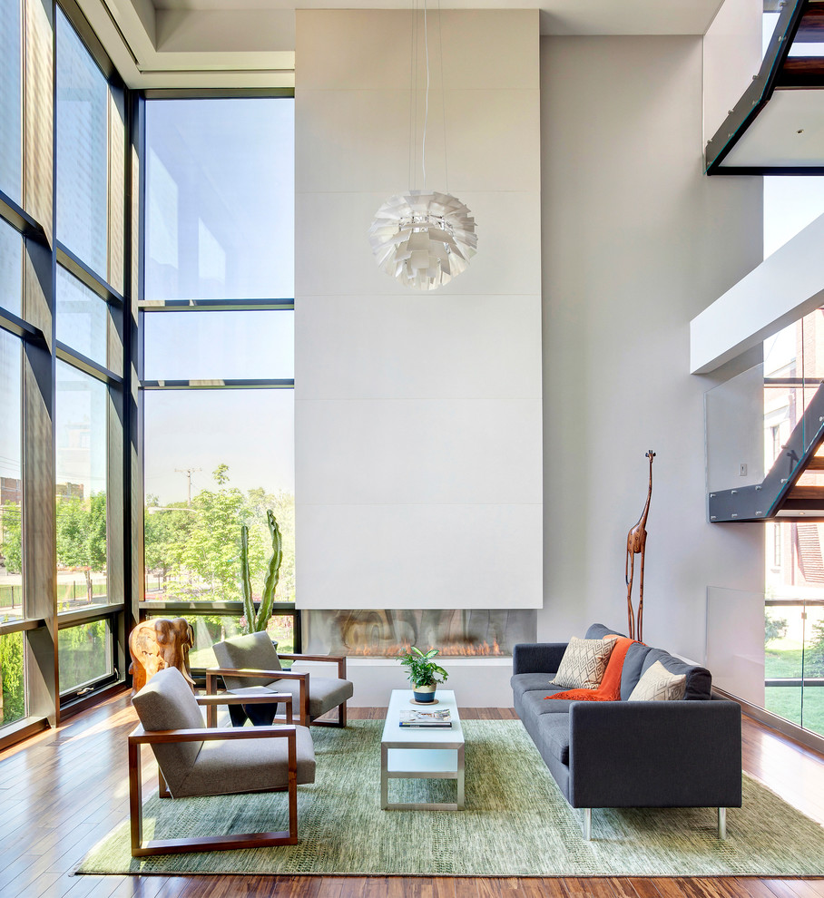 Trendy formal medium tone wood floor living room photo in Chicago with white walls and a ribbon fireplace