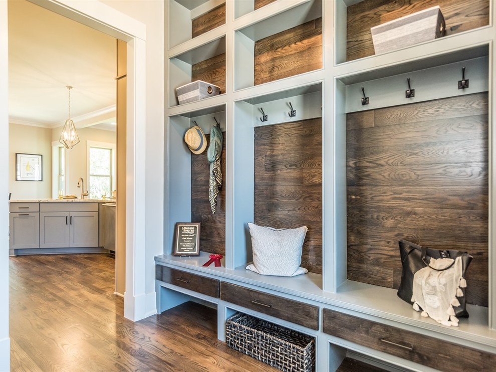 Photo of an arts and crafts mudroom in Raleigh with beige walls and dark hardwood floors.