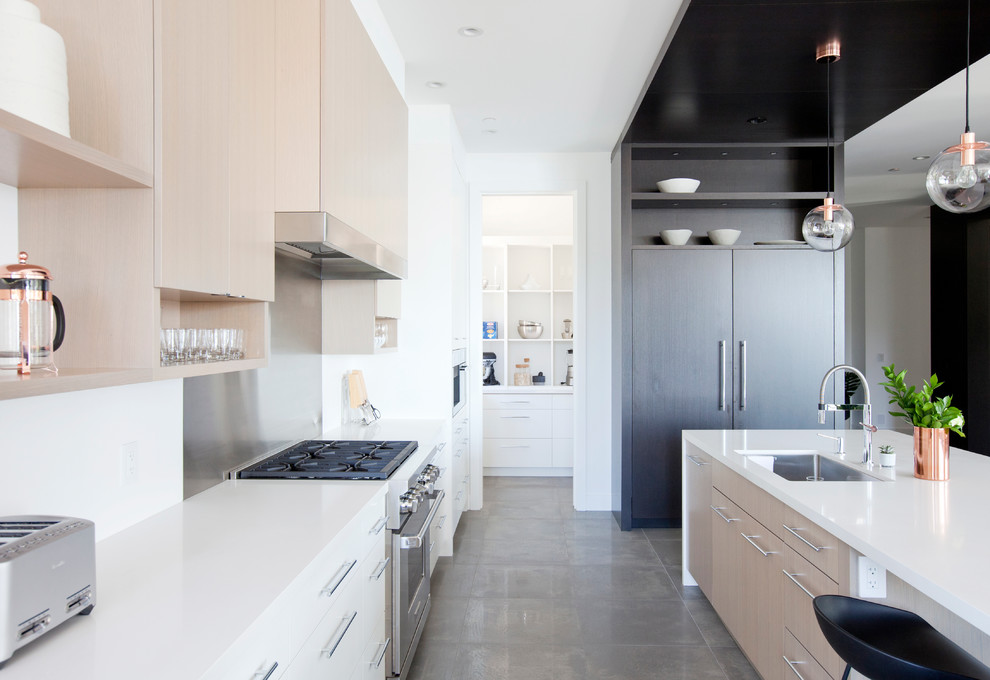 Large contemporary open plan kitchen in Vancouver with an undermount sink, flat-panel cabinets, dark wood cabinets, quartz benchtops, white splashback, stone slab splashback, panelled appliances, porcelain floors and with island.