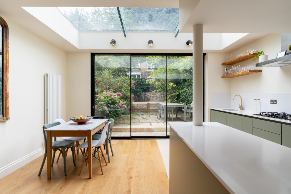 This is an example of a large modern open plan kitchen in London.