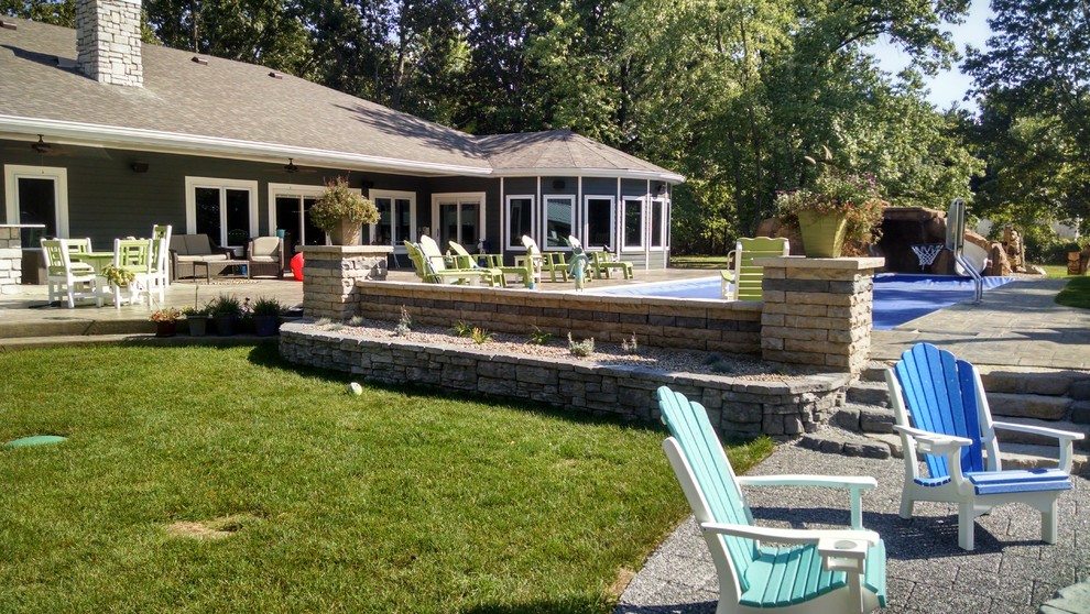 Inspiration for a huge rustic full sun backyard stone outdoor basketball/tennis/multi-game court.