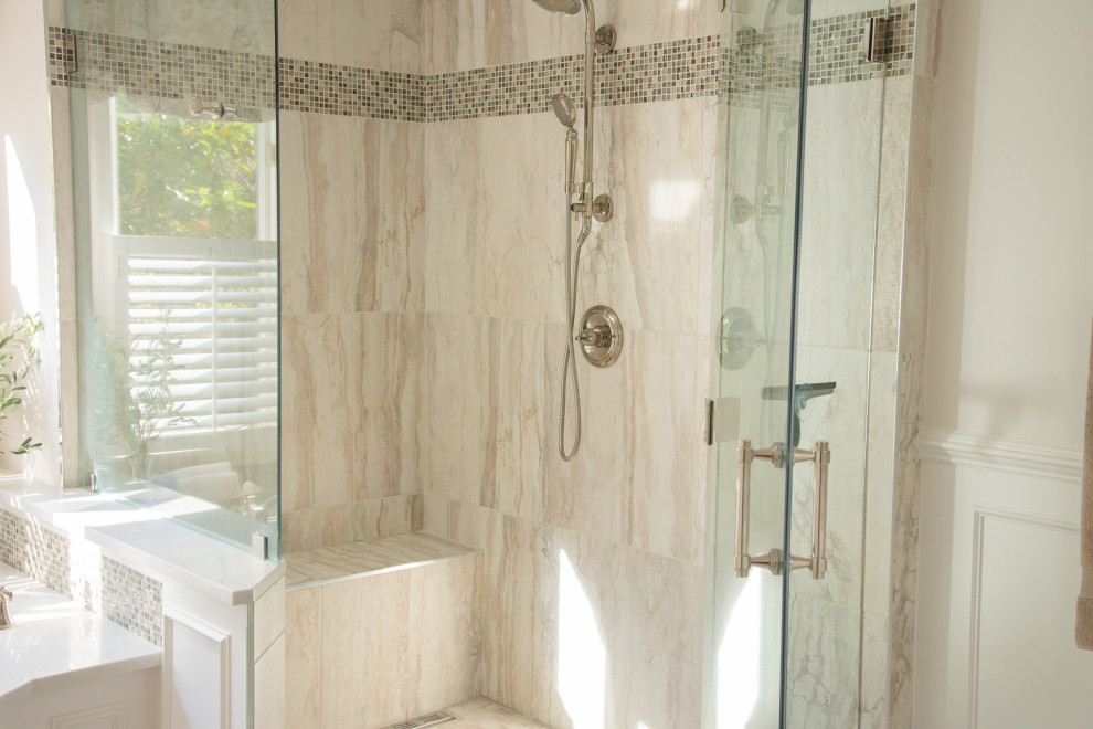 Mid-sized transitional master corner shower photo in Baltimore with a hinged shower door