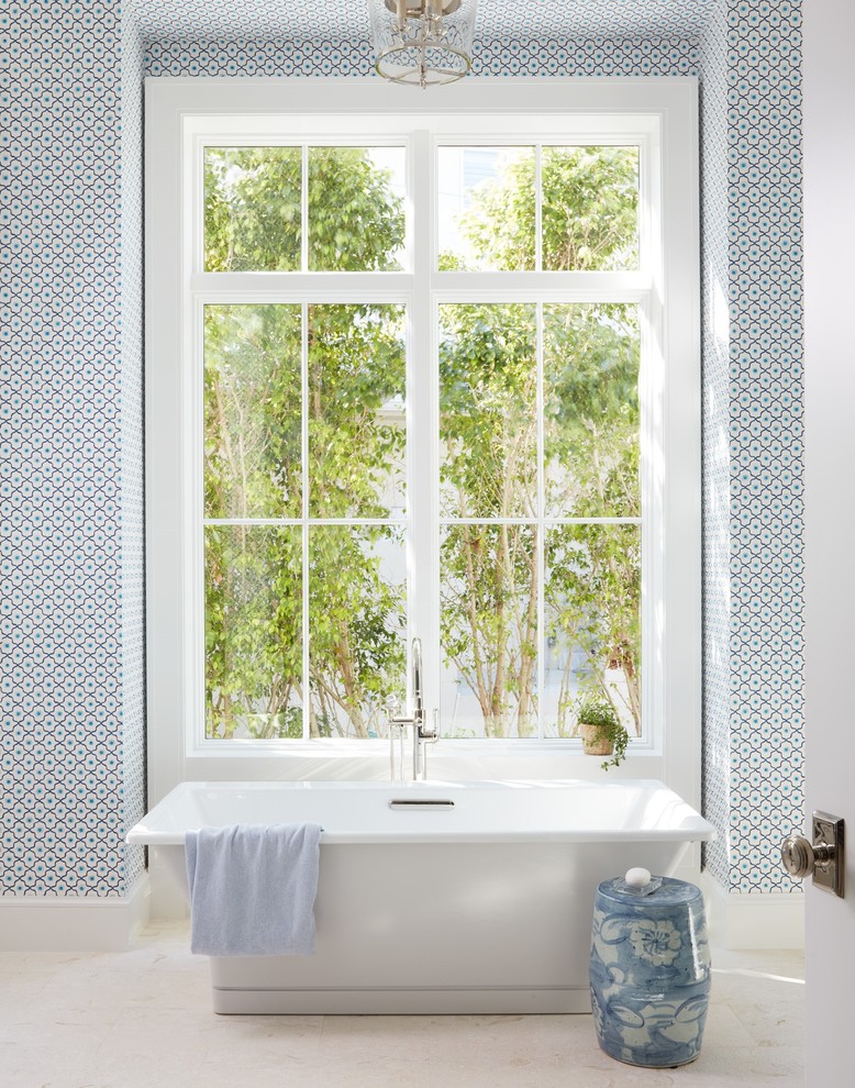 Transitional 3/4 beige floor freestanding bathtub photo with blue walls