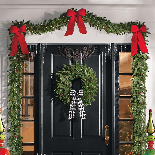 Holiday Decoration at the front door with Garland and bows