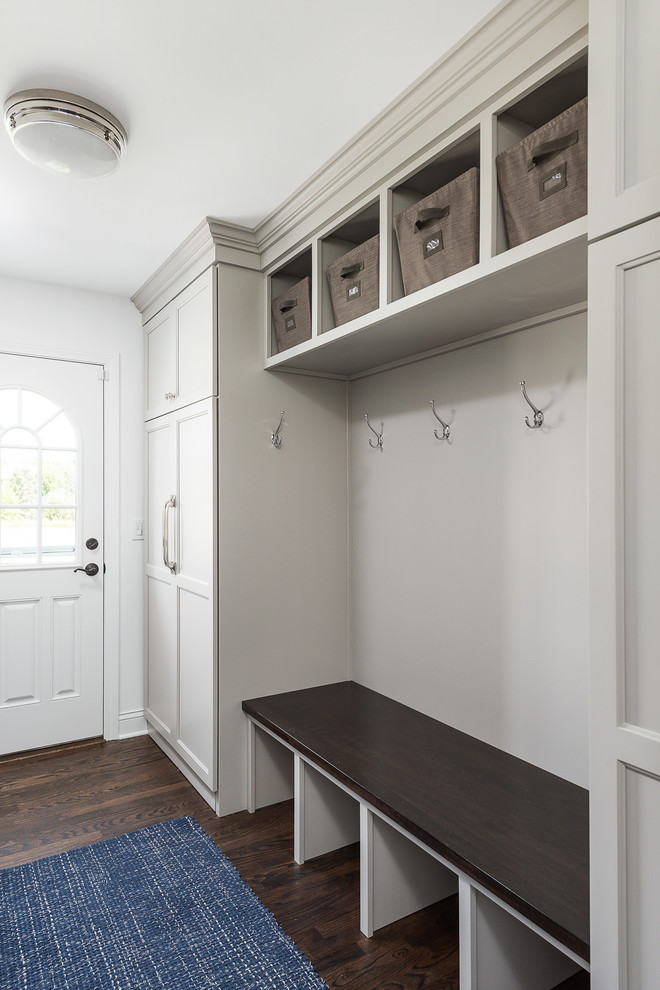 Large transitional galley utility room in Chicago with flat-panel cabinets, white cabinets, grey walls, dark hardwood floors and brown floor.