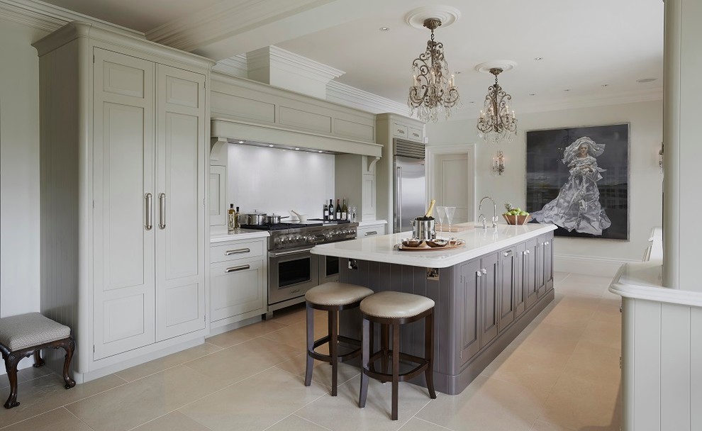 Inspiration for a large traditional galley eat-in kitchen in Other with a farmhouse sink, raised-panel cabinets, grey cabinets, quartzite benchtops, white splashback, stone slab splashback, stainless steel appliances, limestone floors and with island.