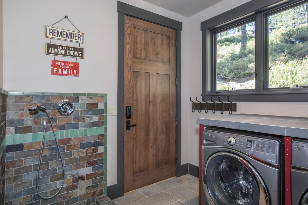 Country laundry room in Sacramento with tile benchtops, white walls, a side-by-side washer and dryer, grey floor and grey benchtop.