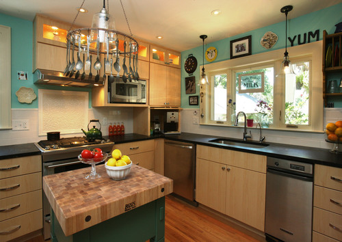 Modern Canadian kitchen with light wood RTA cabinets and butcher-block island—clean, level installation showcasing even reveals and aligned wall units