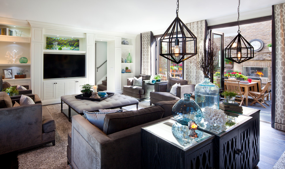 Inspiration for a large transitional enclosed family room in San Diego with grey walls, dark hardwood floors and a built-in media wall.