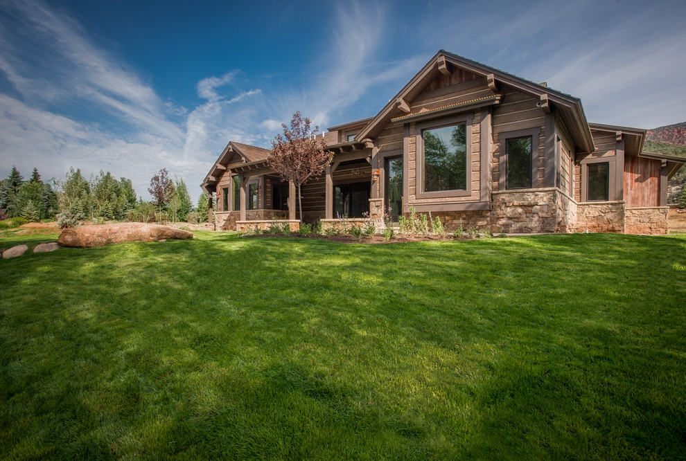 Mountain style home design photo in Denver