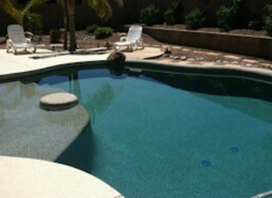 Inspiration for a backyard custom-shaped natural pool remodel in Phoenix