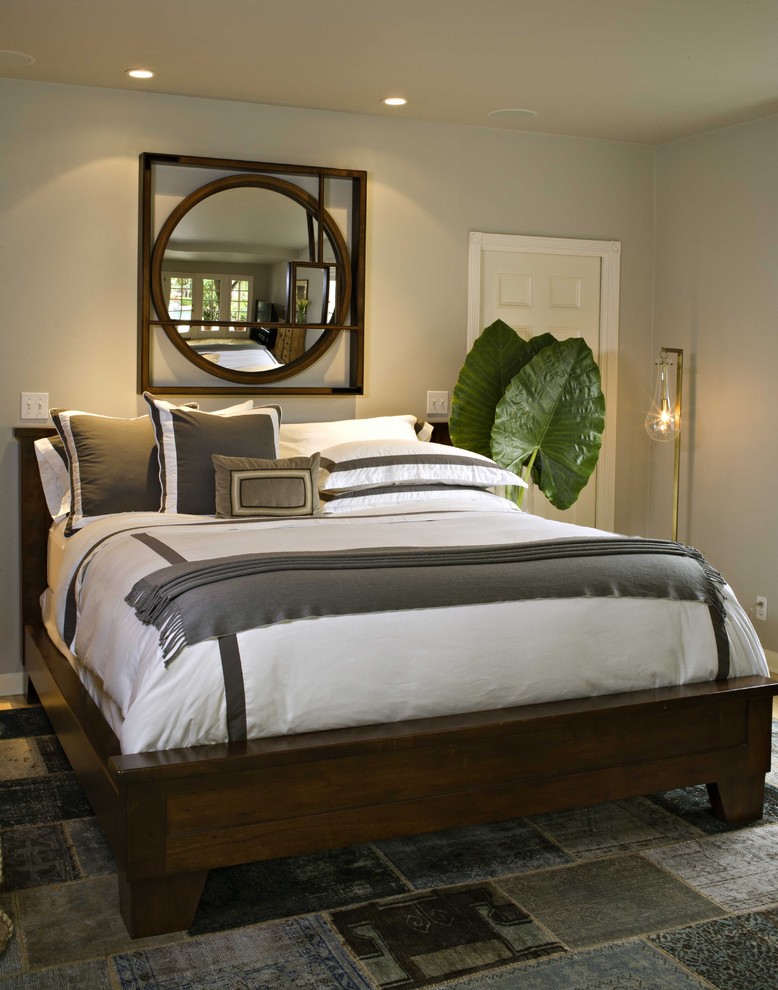 This is an example of a mediterranean bedroom in Los Angeles with grey walls.