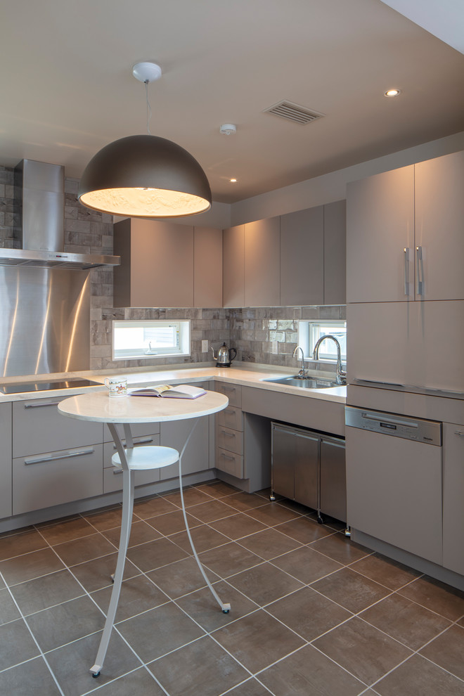 This is an example of a traditional l-shaped kitchen in Tokyo with a single-bowl sink, flat-panel cabinets, grey cabinets, grey splashback, grey floor, white benchtop, solid surface benchtops, ceramic floors and no island.