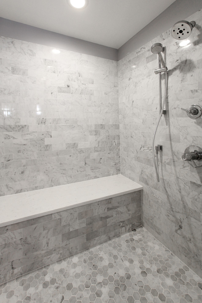 Photo of a mid-sized modern master bathroom in Philadelphia with an alcove shower, ceramic floors, grey floor, a hinged shower door, recessed-panel cabinets, grey cabinets, gray tile, subway tile, blue walls, an undermount sink, marble benchtops and white benchtops.