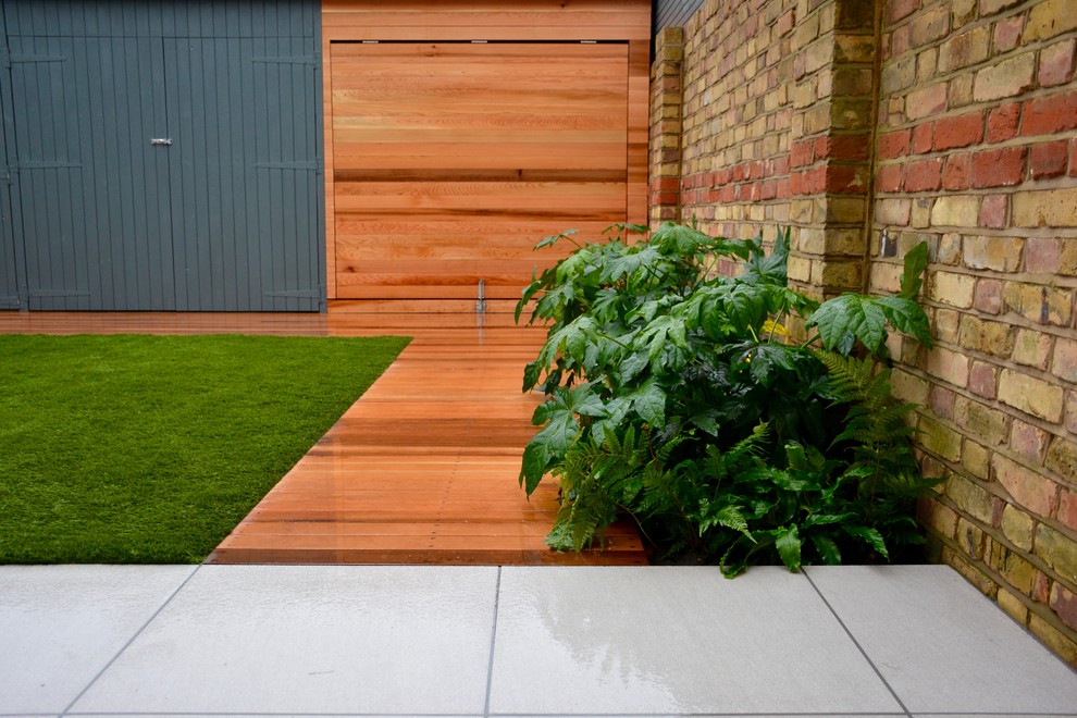 This is an example of a medium sized contemporary garden shed and building in London.