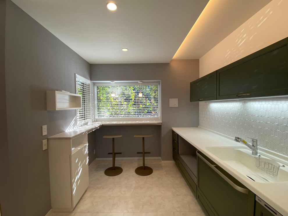 Inspiration for a single-wall eat-in kitchen in Tokyo Suburbs with an integrated sink, solid surface benchtops, timber splashback, plywood floors, white floor, white benchtop, wallpaper and green cabinets.
