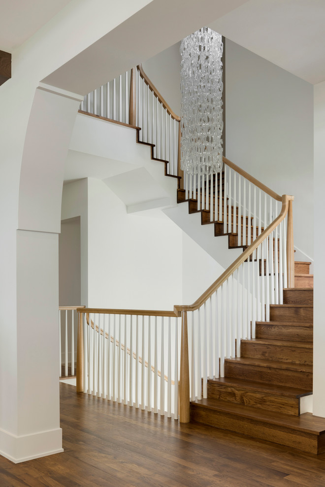Photo of a country wood l-shaped staircase in Minneapolis with wood risers and wood railing.