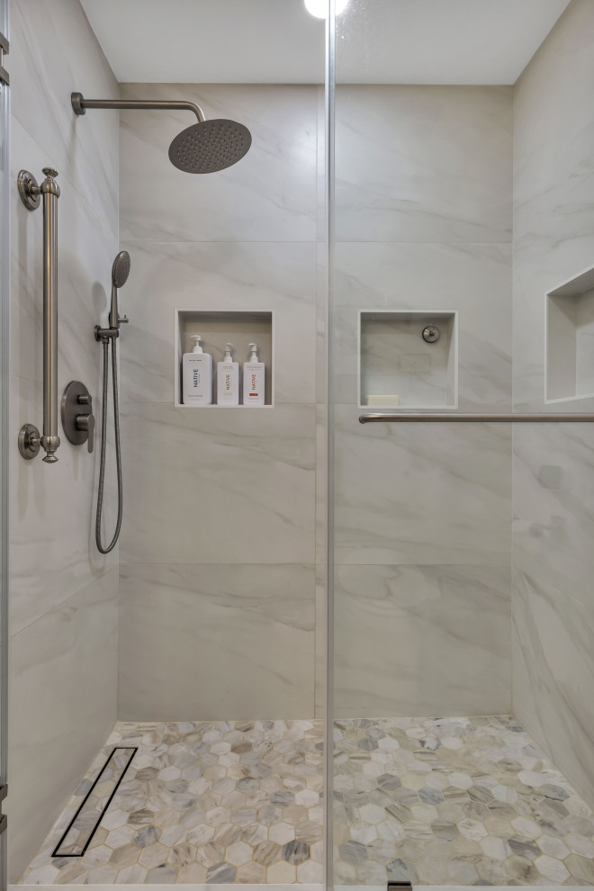Example of a small 1960s 3/4 gray tile and ceramic tile ceramic tile, multicolored floor, double-sink and brick wall alcove shower design in Seattle with flat-panel cabinets, brown cabinets, a two-piece toilet, gray walls, an undermount sink, quartz countertops, a hinged shower door, white countertops and a floating vanity