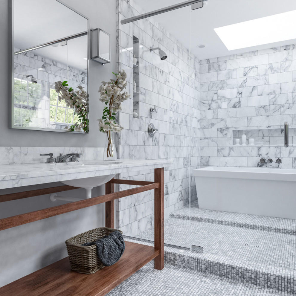 Design ideas for a classic wet room bathroom in Atlanta with open cabinets, medium wood cabinets, a freestanding bath, grey tiles, grey walls, mosaic tile flooring, a submerged sink, white worktops, a wall niche and a freestanding vanity unit.
