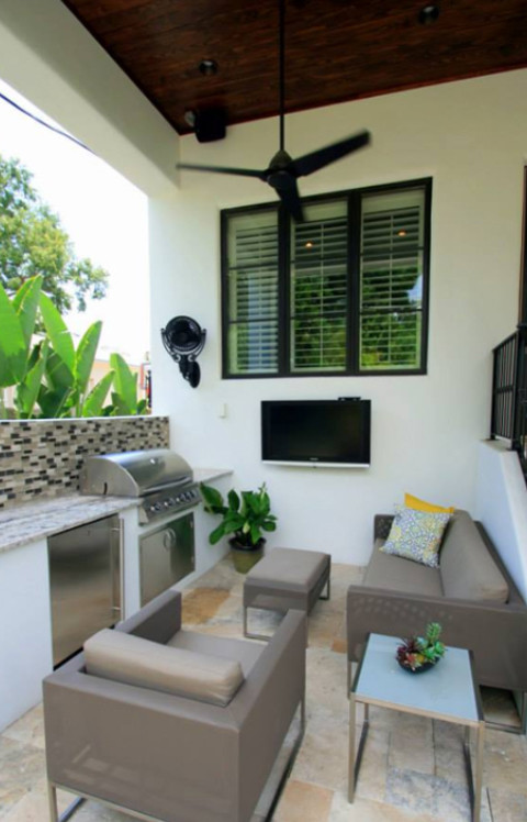 Design ideas for a small mediterranean one-storey stucco white exterior in Tampa.