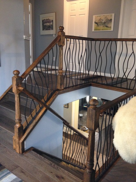 BENT iron design interior railing with a distressed wood ...