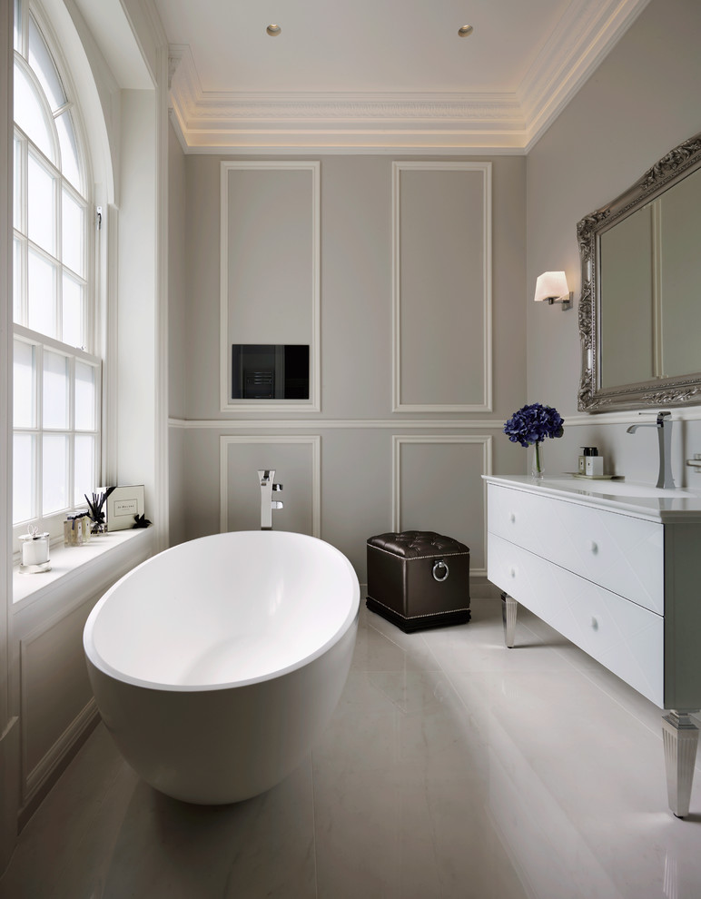 Inspiration for a transitional bathroom in London with a freestanding tub.