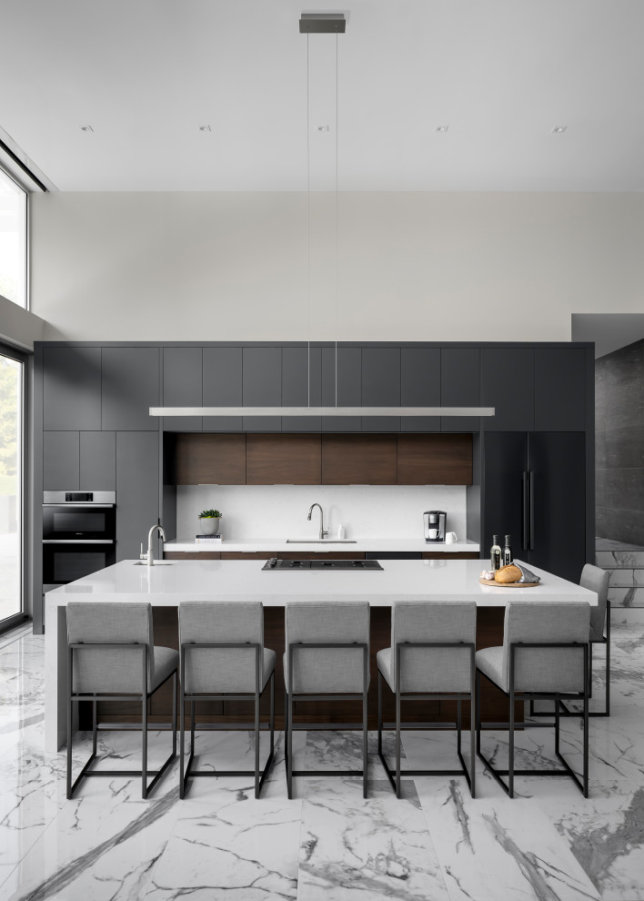 Inspiration for an expansive modern single-wall eat-in kitchen in Toronto with an undermount sink, flat-panel cabinets, black cabinets, quartz benchtops, white splashback, stone slab splashback, black appliances, marble floors, multiple islands, grey floor and white benchtop.
