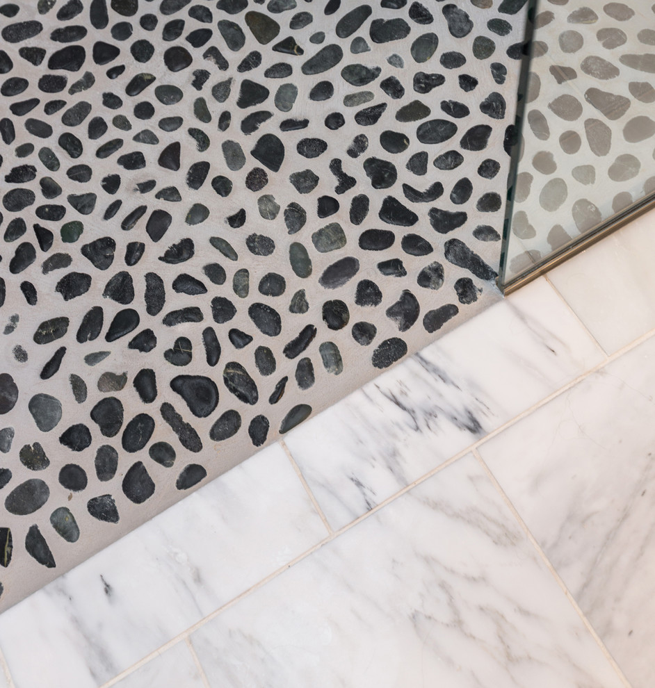 Mid-sized transitional master gray tile and mosaic tile marble floor home design photo with an undermount sink, recessed-panel cabinets, dark wood cabinets, quartzite countertops, a one-piece toilet and gray walls