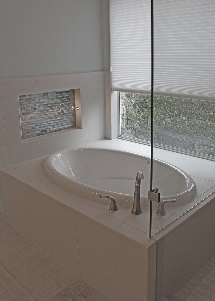 Large transitional master beige tile and porcelain tile porcelain tile and beige floor drop-in bathtub photo in Austin with shaker cabinets, white cabinets, blue walls, an undermount sink, quartz countertops, a hinged shower door, beige countertops and a two-piece toilet