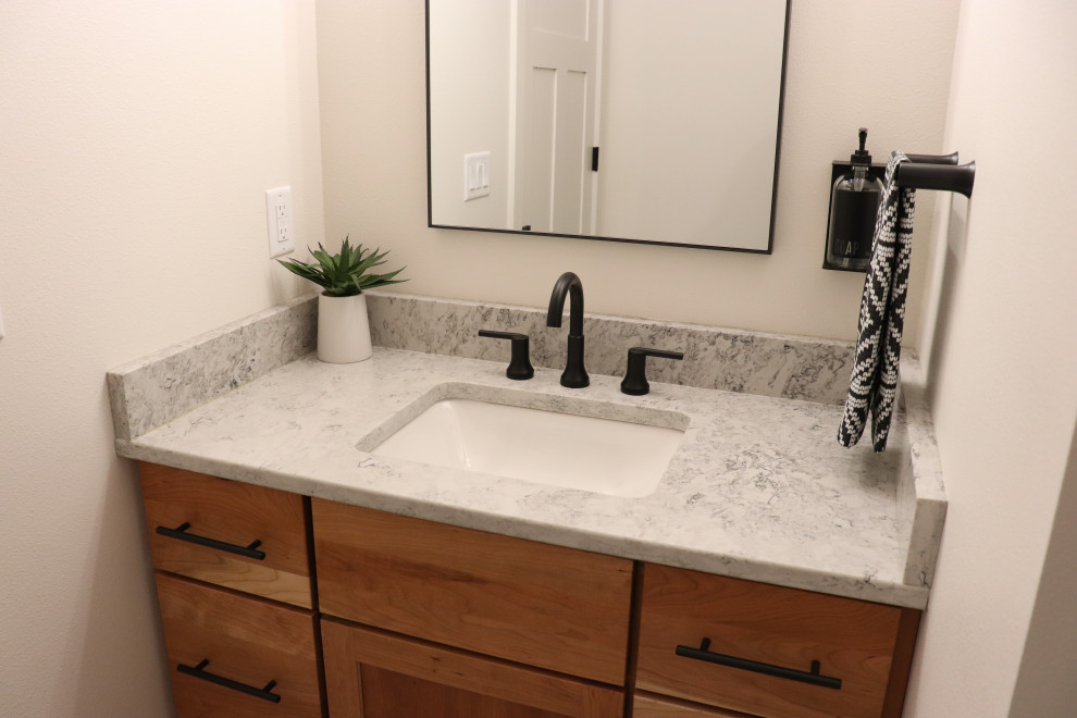 Inspiration for a large transitional l-shaped medium tone wood floor and brown floor open concept kitchen remodel with a single-bowl sink, shaker cabinets, white cabinets, quartz countertops, gray backsplash, subway tile backsplash, stainless steel appliances, an island and white countertops