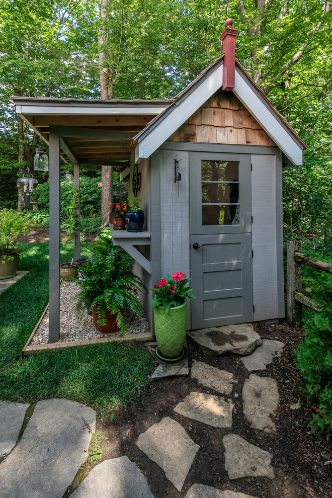 Photo of a mid-sized country detached garden shed in Charlotte.