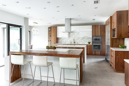 Contemporary kitchen with handle-less premade kitchen cabinet fronts and modern island layout