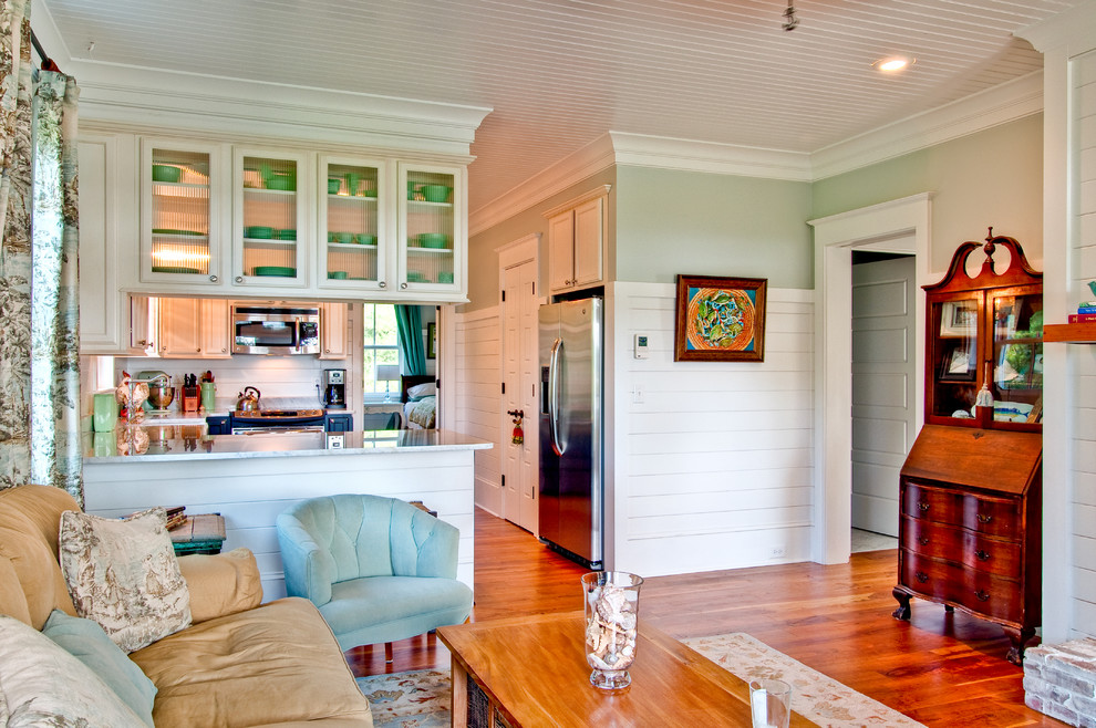 Design ideas for a traditional living room in Charleston with green walls.